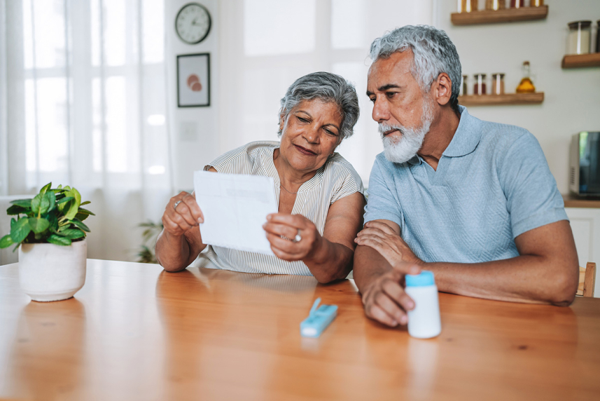 Couple reading prescription paper