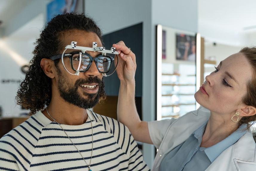 An adult man tapping into his UnitedHealthcare Vision benefits