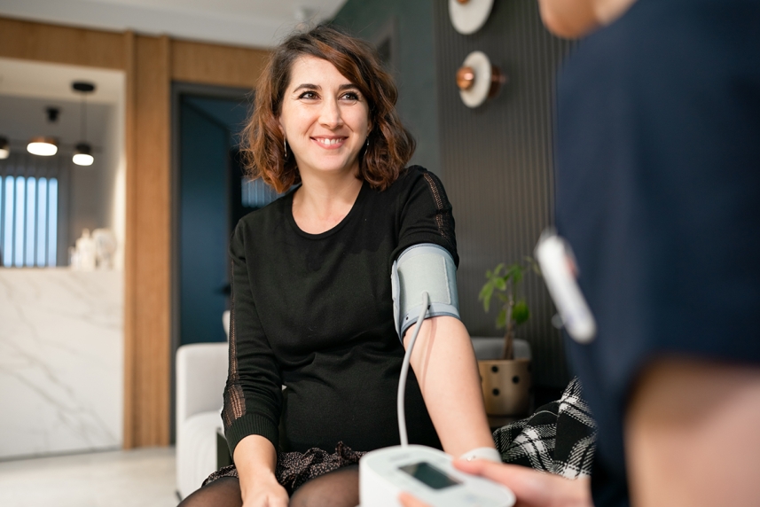 Young woman taking a blood pressure test