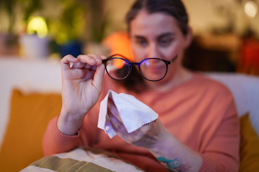Woman cleaning glasses