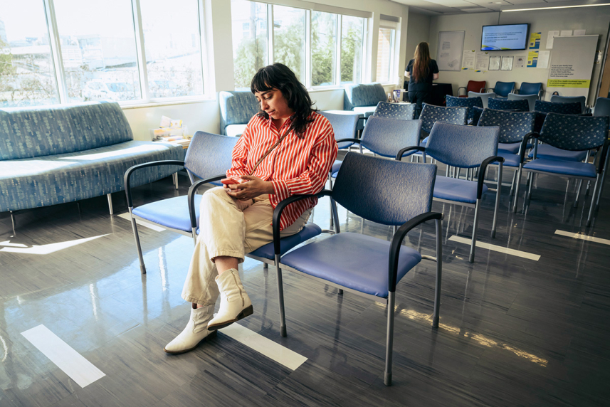 Woman sitting in waiting room