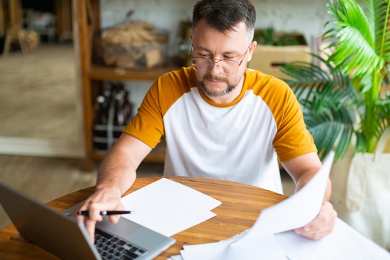 Adult man thinking about bundling his vision and dental plans