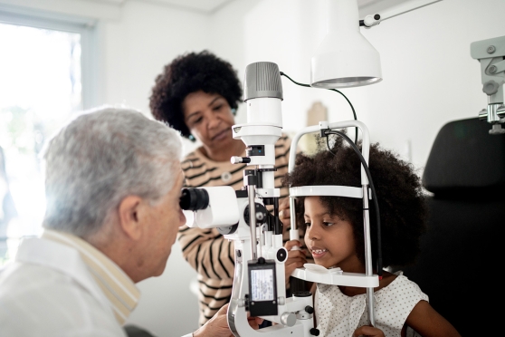 Female child getting eye exam