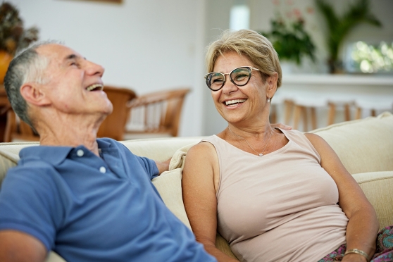 Couple sitting on the couch talking