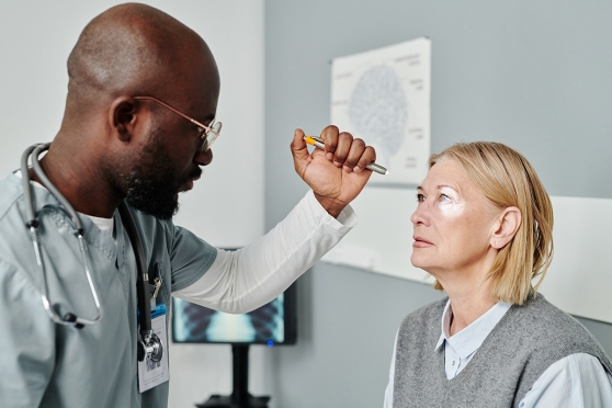 Person having their eyes exam by optometrist