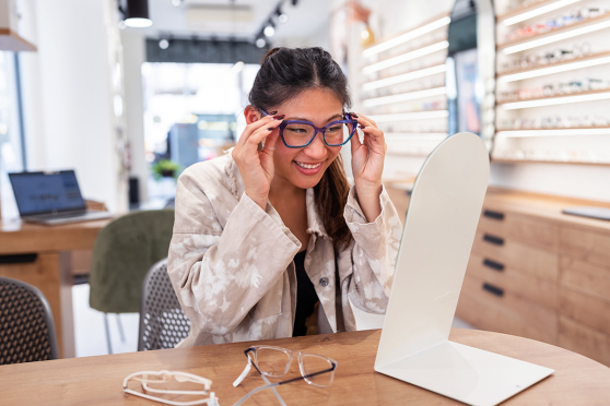 Woman trying on glasses