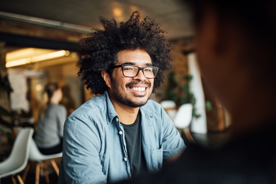 Person wearing glasses smiling