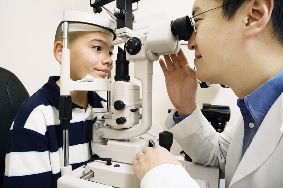 A young boy getting his eyes checked for digital eye strain
