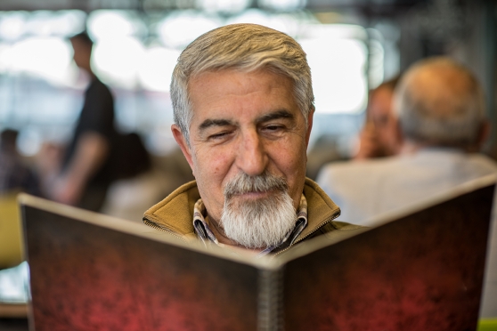 Person reading the menu