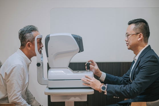An older man learning the difference between a vision screening and comprehensive eye exam 
