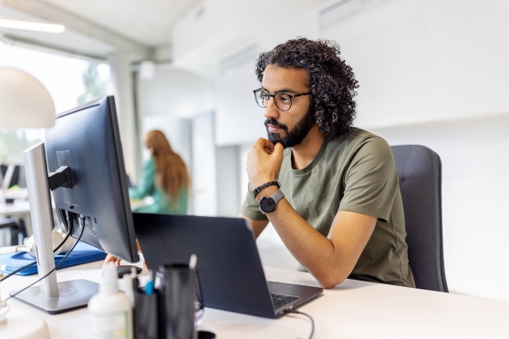 Adult man wearing his top glasses choice at the office 