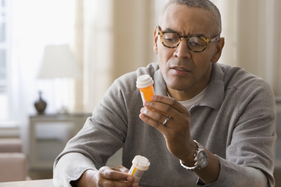 Person looking at their medication