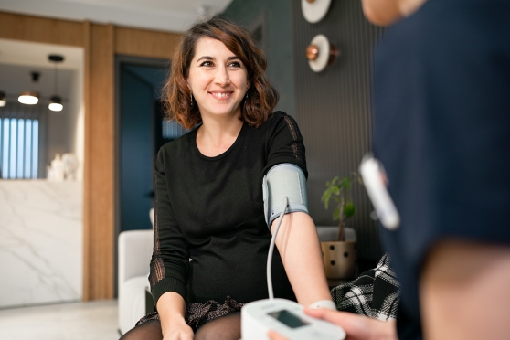 Young woman taking a blood pressure test
