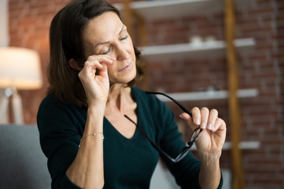 Person rubbing their eye