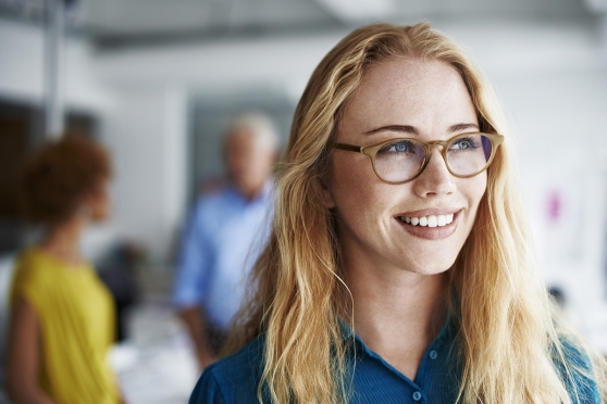 Person with glasses smiling