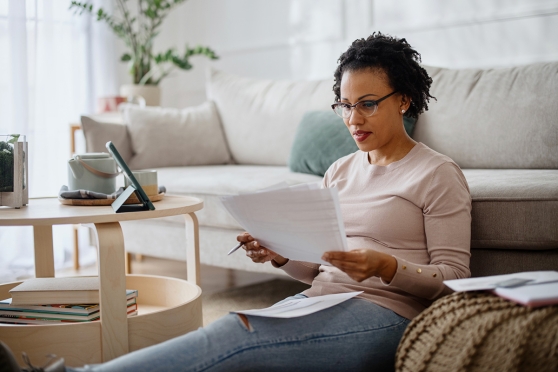 An adult woman reviewing in-network and out-of-network eye care providers 