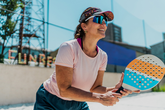 Woman playing beach tennis