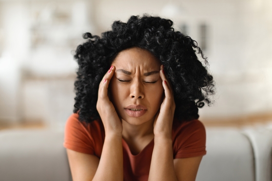 An adult woman wondering if she’s experiencing a migraine or eye issue 